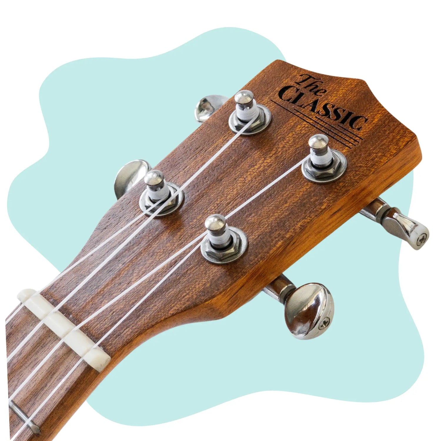 The classic ukulele headstock with a warm brown wood finish and silver tuning pegs.