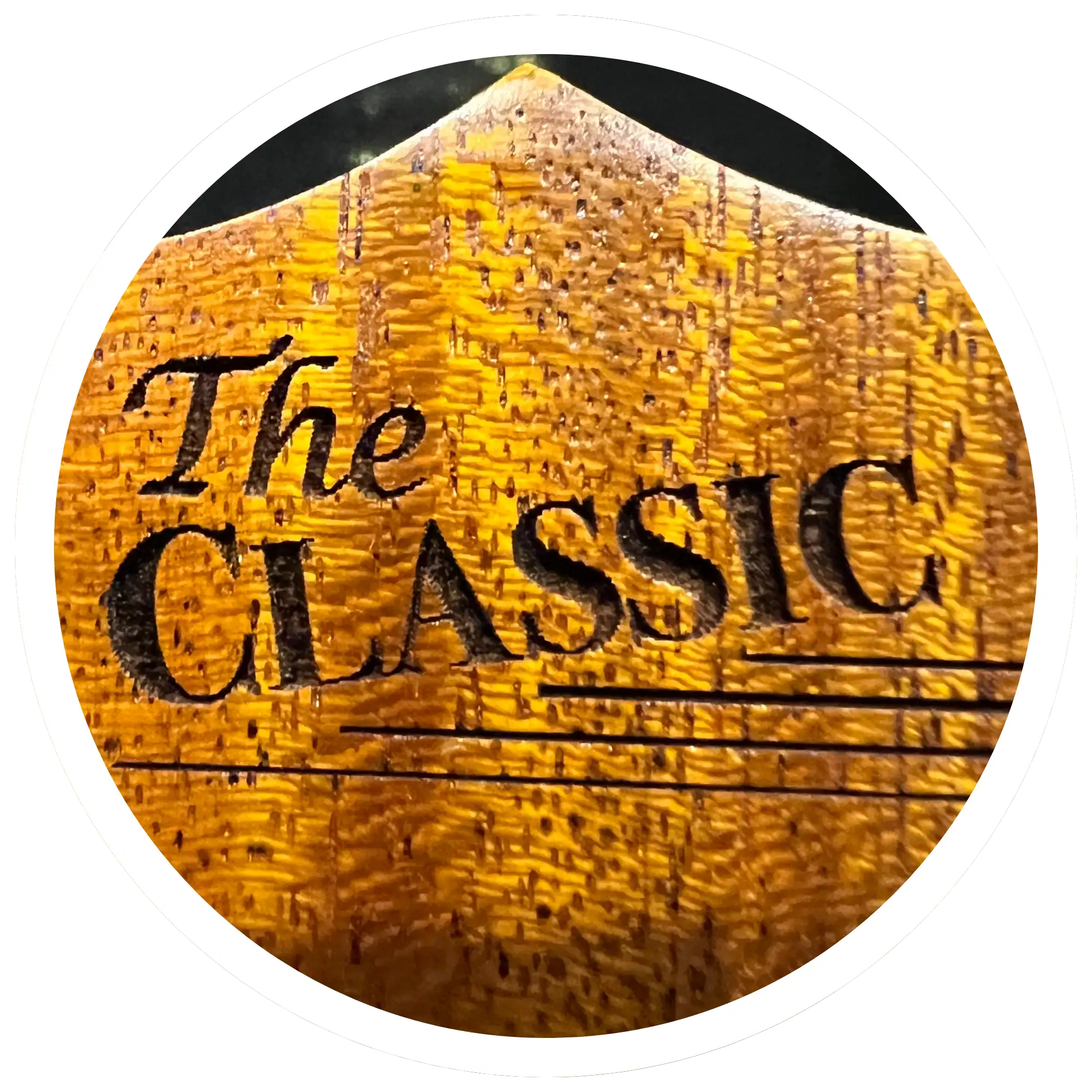 Golden textured wooden plaque with engraved black text reading ’the classic.’